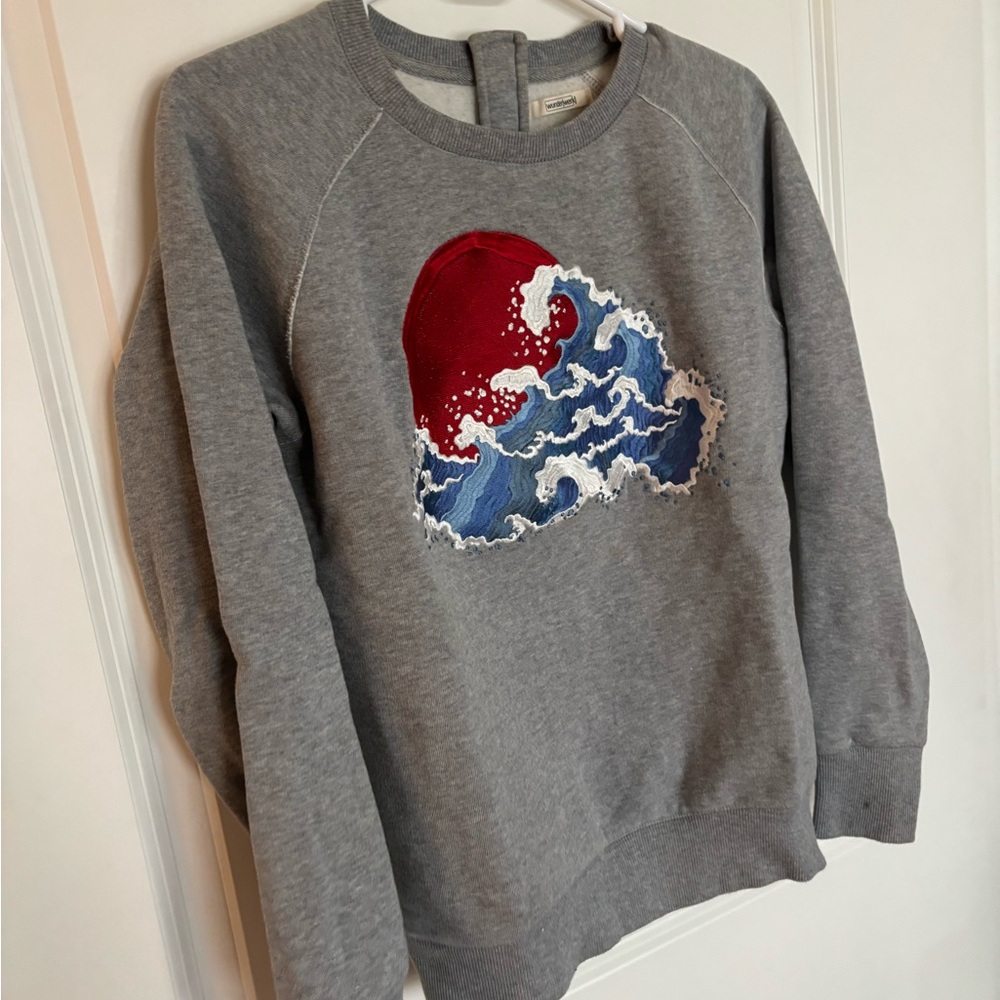 Emoji of a Wave Sweater from Germany
